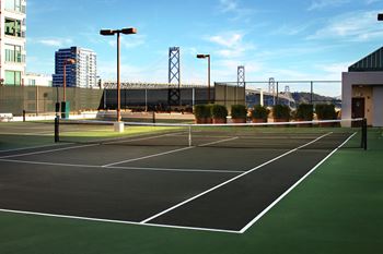 Two rooftop lighted tennis courts, rooftop outdoor living room